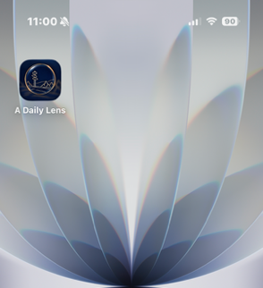 A Daily Lens app icon on an iPhone